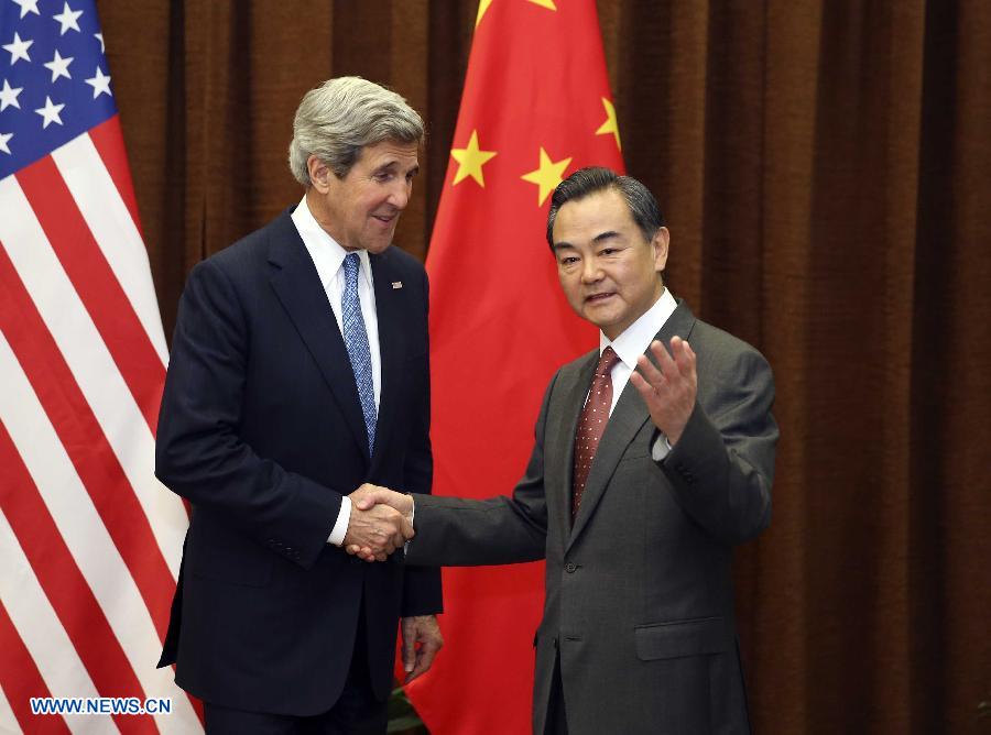 Chinese Foreign Minister Wang Yi (R) shakes hands with U.S. Secretary of State John Kerry in Beijing, capital of China, April 13, 2013. (Xinhua/Ding Lin)