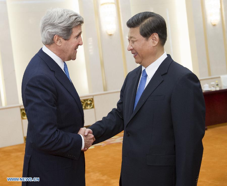 Chinese President Xi Jinping (R) shakes hands with U.S. Secretary of State John Kerry during their meeting in Beijing, capital of China, April 13, 2013. (Xinhua/Huang Jingwen) 