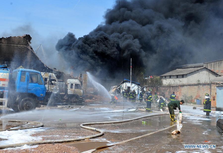 Firefighters work at the accident site after an explosion ripped through a warehouse of a chemical factory in the Dongxihu District of Wuhan, capital city of central China's Hubei Province, April 13, 2013. The casualties were unknown so far. (Xinhua/Xiao Yijiu) 