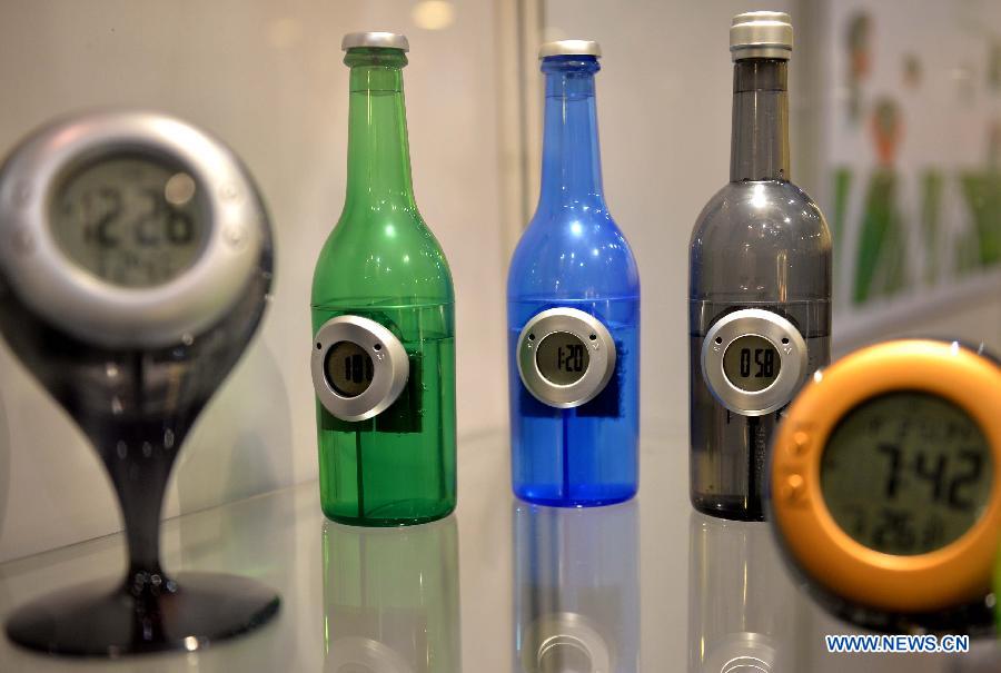 Photo taken on April 13, 2013 shows bottle-shaped electronic watches displayed at the 10th Hong Kong Electronics Fair (Spring Edition) in south China's Hong Kong. The four-day fair, which kicked off on Saturday, attracted 3,250 enterprises from 24 countries and regions. (Xinhua/Chen Xiaowei)