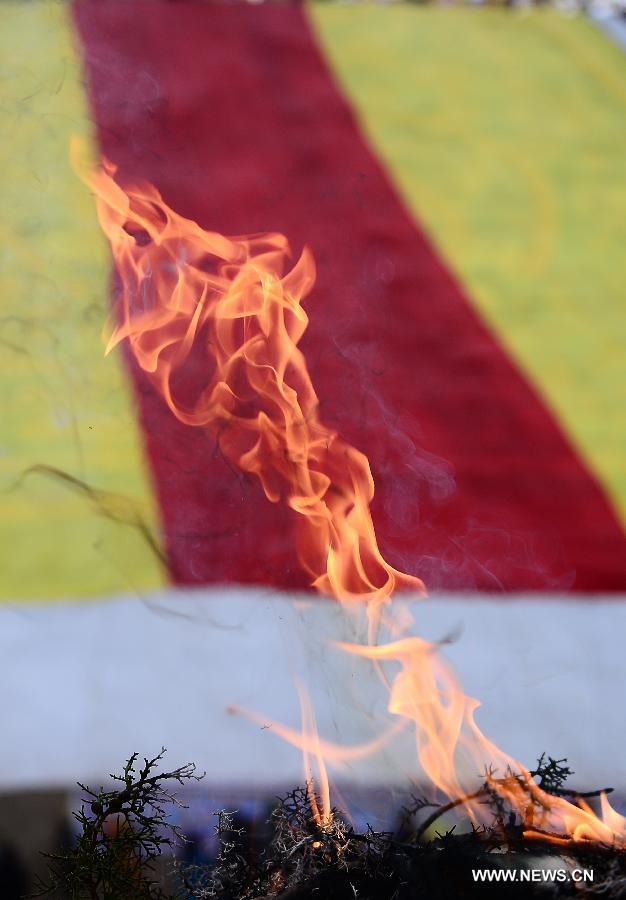 A "Weisang" ceremony, or pine branch burning, is held during a Buddhist commemoration marking the third anniversary of the Yushu earthquake, in Yushu Tibetan Autonomous Prefecture, northwest China's Qinghai Province, April 14, 2013. A 7.1-magnitude earthquake hit Yushu on April 14, 2010, leaving 2,698 dead and over 12,000 injured. (Xinhua/Zhang Hongxiang) 