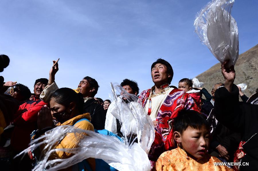 Tibetans pray for the victims during a Buddhist commemoration marking the third anniversary of the Yushu earthquake, in Yushu Tibetan Autonomous Prefecture, northwest China's Qinghai Province, April 14, 2013. A 7.1-magnitude earthquake hit Yushu on April 14, 2010, leaving 2,698 dead and over 12,000 injured. (Xinhua/Zhang Hongxiang) 
