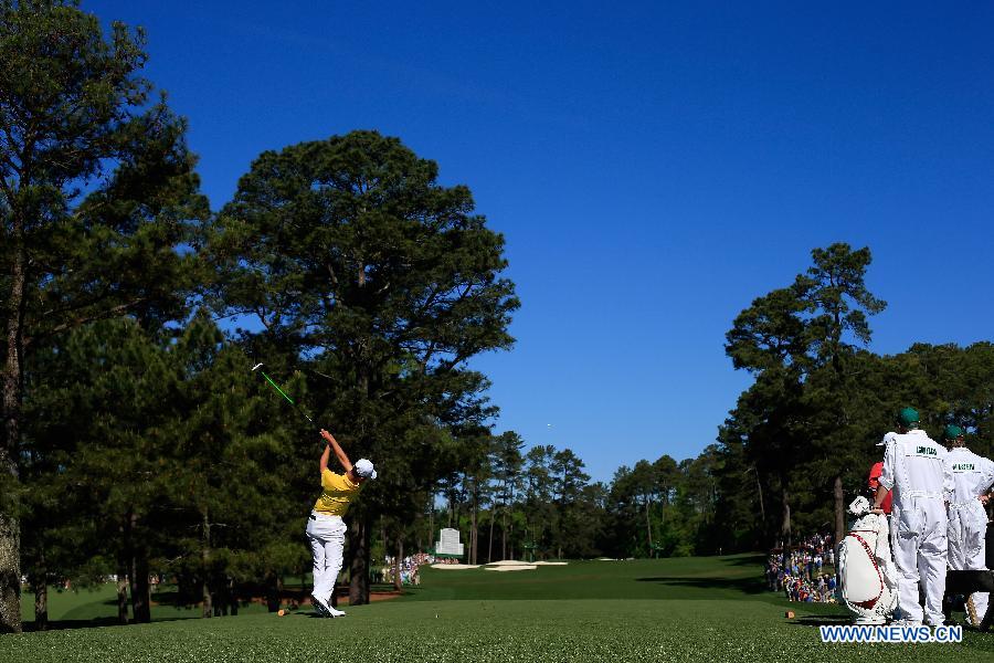 China's Guan Tianlang tees off on the third hole during the third round of the 2013 Masters golf tournament at the Augusta National Golf Club in Augusta, Georgia, the United States, April 13, 2013. Guan shot a five-over par 77 Saturday. (Xinhua/Chris Trotman/Augusta National)