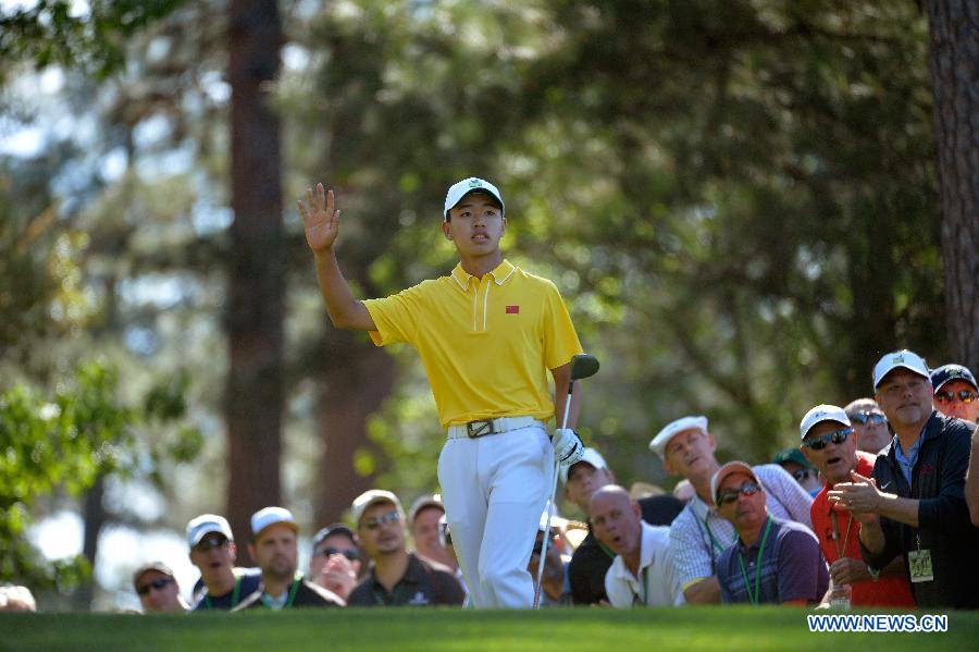 China's Guan Tianlang gestures during the third round of the 2013 Masters golf tournament at the Augusta National Golf Club in Augusta, Georgia, the United States, April 13, 2013. Guan shot a five-over par 77 Saturday. (Xinhua/Charles Laberge/Augusta National)
