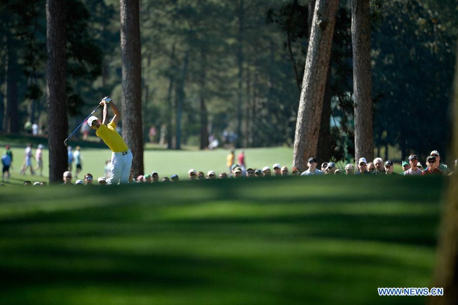 China's Guan Tianlang competes during the third round of the 2013 Masters golf tournament at the Augusta National Golf Club in Augusta, Georgia, the United States, April 13, 2013. Guan shot a five-over par 77 Saturday. (Xinhua/Charles Laberge/Augusta National)