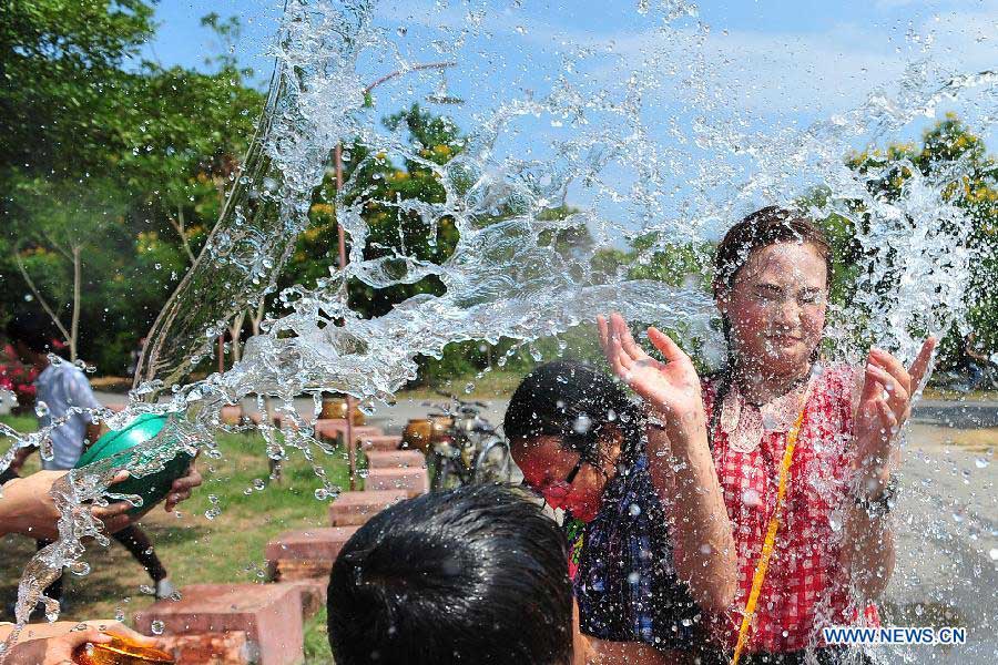 People splash water during celebrations for Songkran Festival, Thailand's traditional New Year Festival, at the Ancient City in Samut Prakan Province, Thailand, April 14, 2013. Songkran, also known as the Water Splashing Festival, started here on April 13 this year. (Xinhua/Rachen Sageamsak)
