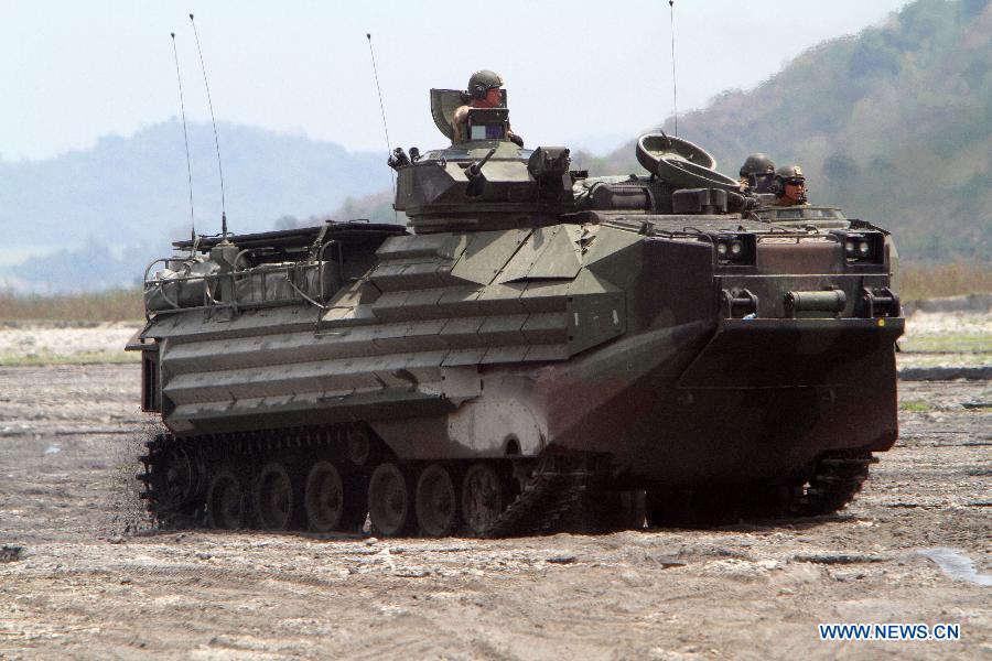 U.S. marines ride their amphibious armored vehicle during a joint military exercise in Tarlac Province, the Philippines, April 12, 2013. The Philippines and the U.S. held their 29th annual joint military exercise with at least 8,000 American and Filipino soldiers participating in the training. The joint military exercise, more known as Balikatan, which means "shoulder-to-shoulder" in Filipino, is held from April 5 to 17. (Xinhua/Rouelle Umali)