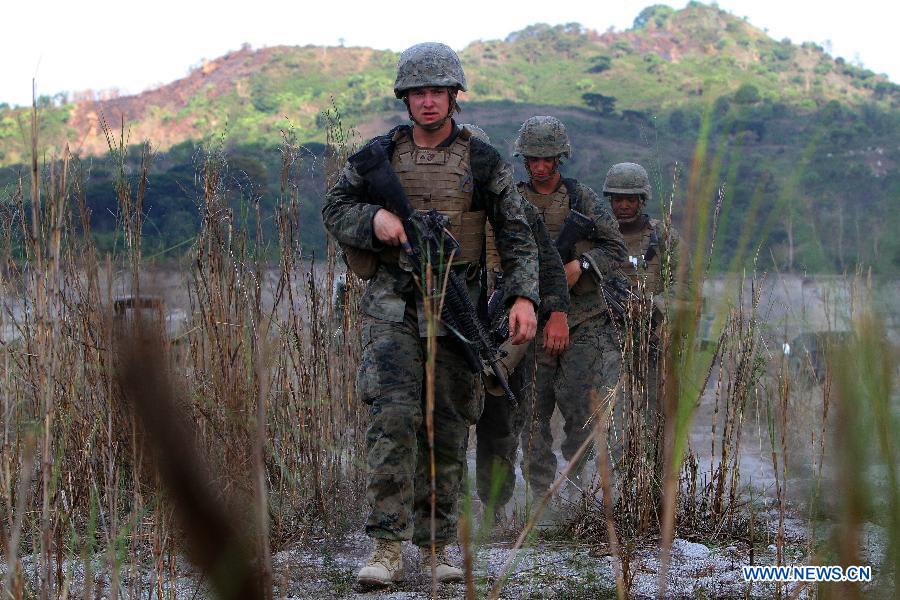 U.S. marines march during a joint military exercise in Tarlac Province, the Philippines, April 12, 2013. The Philippines and the U.S. held its 29th annual joint military exercise with at least 8,000 American and Filipino soldiers participating in the training. The joint military exercise, more known as Balikatan, which means "shoulder-to-shoulder" in Filipino, is held from April 5 to 17. (Xinhua/Rouelle Umali)