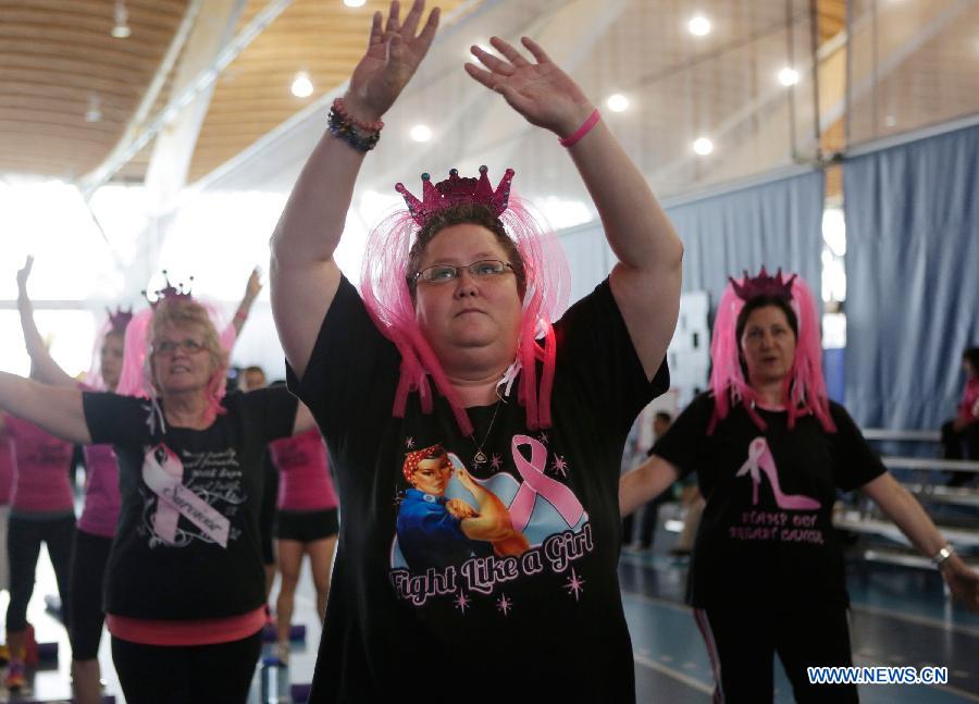 Ladies participate in a marathon exercise fund raising event at the Richmond Oval in Richmond, Canada, on April 13, 2013. Over 300 women take part in a marathon seven-hour dance at the Bust a Move event to raise fund for BC Cancer Foundation in order to help fighting against the breast cancer. (Xinhua/Liang Sen)