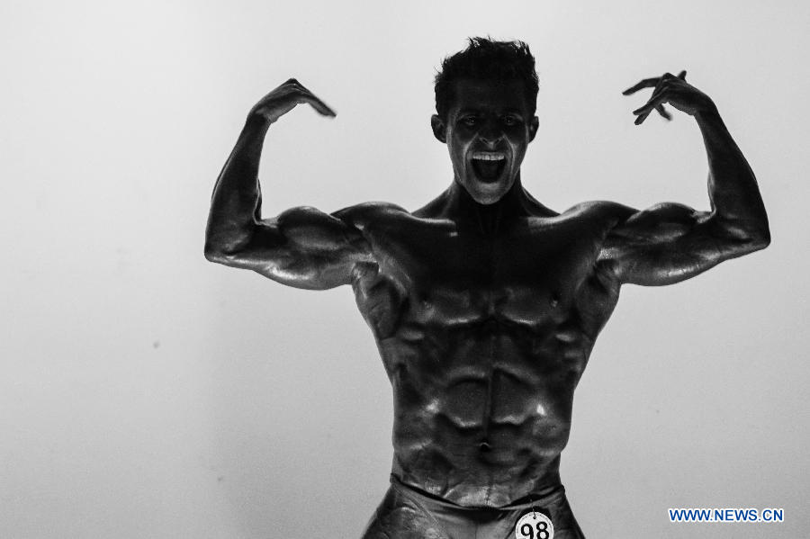 A bodybuilder participates in a bodybuilding competition called "Mr. Colombia" held in Bogota, capital of Colombia, on April 13, 2013. (Xinhua/Jhon Paz)