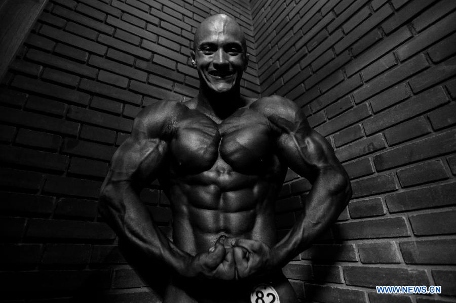 A bodybuilder participates in a bodybuilding competition called "Mr. Colombia" held in Bogota, capital of Colombia, on April 13, 2013. (Xinhua/Jhon Paz)