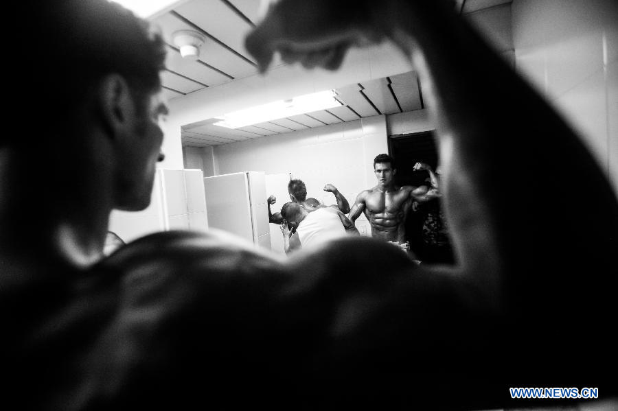 A bodybuilder participates in a bodybuilding competition called "Mr. Colombia" held in Bogota, capital of Colombia, on April 13, 2013. (Xinhua/Jhon Paz)