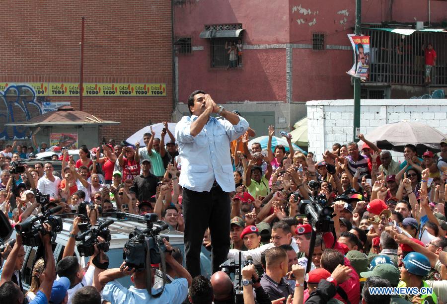 Image provided by the Presidency of Venezuela shows Venezuelan acting President Nicolas Maduro reacting after casting his vote at the Ali Primera Park, in Caracas, capital of Venezuela, on April 14, 2013. Venezuelan acting President Nicolas Maduro has won the presidential election with 50.66 percent of the votes, National Electoral Council President Tibisay Lucena announced on Sunday. (Xinhua/Venezuelan Presidency)