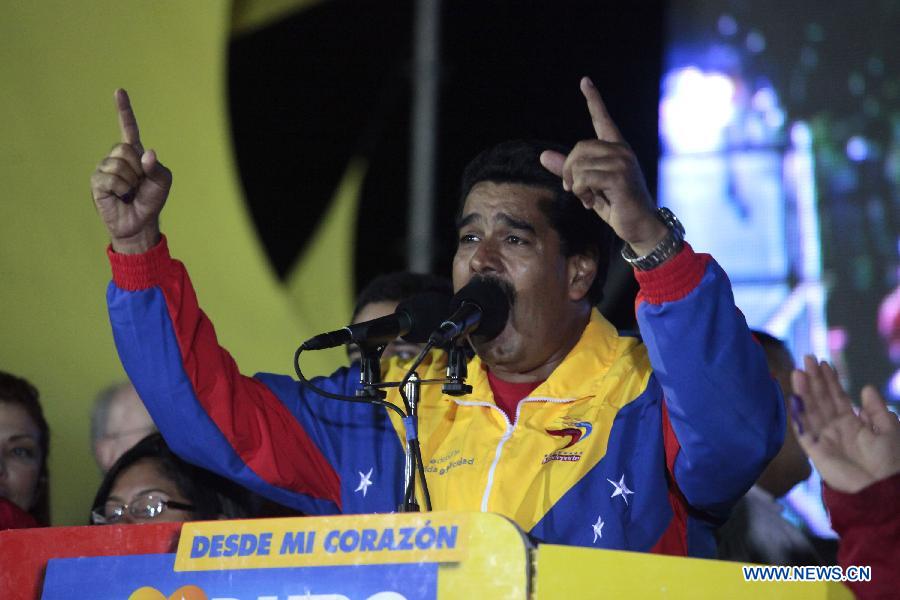 Venezuelan acting President Nicolas Maduro celebrates his victory in Caracas, capital of Venezuela, on April 14, 2013. Venezuelan acting President Nicolas Maduro narrowly won the presidential election with 50.66 percent of the votes, National Electoral Council's President Tibisay Lucena said on Sunday. (Xinhua/AVN)
