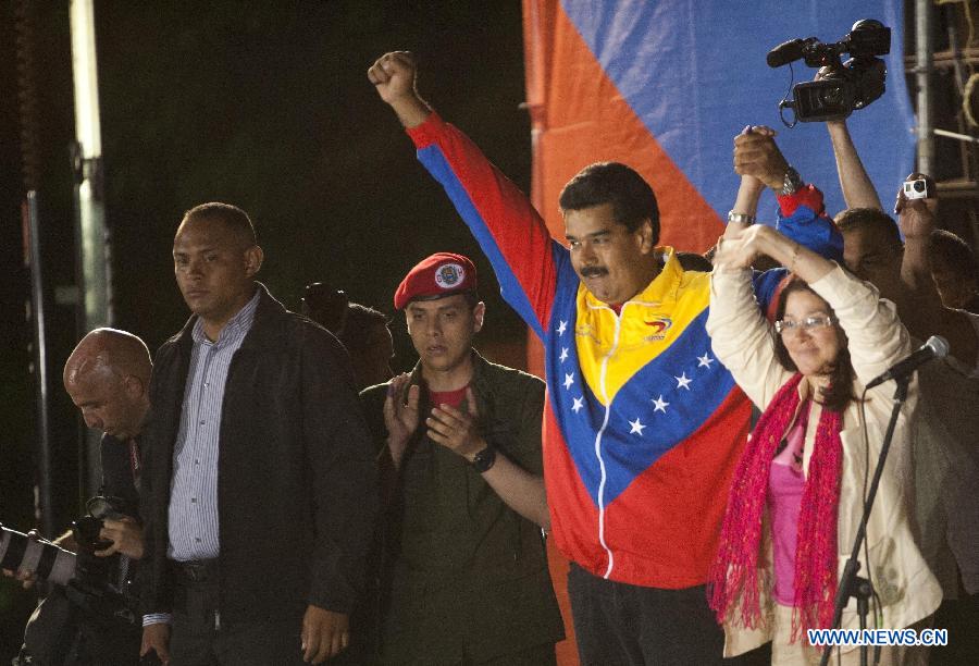 Venezuelan acting President Nicolas Maduro (2nd R) celebrates his victory in Caracas, capital of Venezuela, on April 14, 2013. Venezuelan Acting President Nicolas Maduro narrowly won the presidential election with 50.66 percent of the votes, National Electoral Council's President Tibisay Lucena said on Sunday. (Xinhua/Mauricio Valenzuela) 