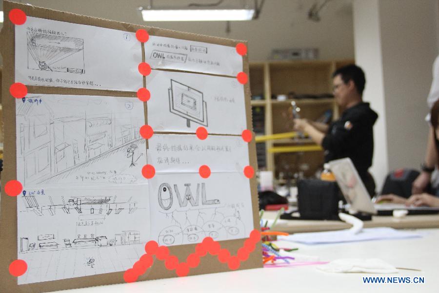 Photo taken on April 14, 2013 shows a sketch of photographic stablization device for cell phones during the Art and Tech Hackathon, an innovation competition organized by a hackerspace Beijing Maxpace, in Beijing, capital of China. Some 23 makers participated in the competition. (Xinhua/Ma Ping)
