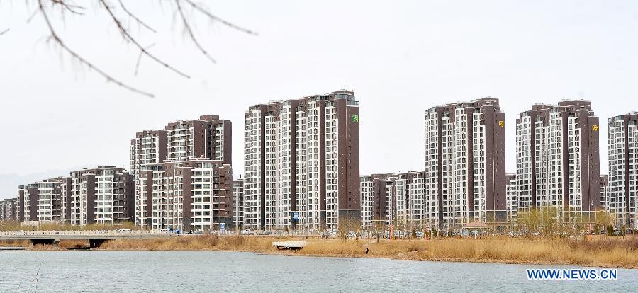 Photo taken on March 18, 2013 shows newly-built residential buildings in Yinchuan, capital of northwest China's Ningxia Hui Autonomous Region. China's gross domestic product (GDP) growth unexpectedly slowed to 7.7 percent in the first quarter of 2013, down from 7.9 percent during the final quarter of 2012, data from the National Bureau of Statistics (NBS) showed on April 15, 2013. (Xinhua/Peng Zhaozhi) 