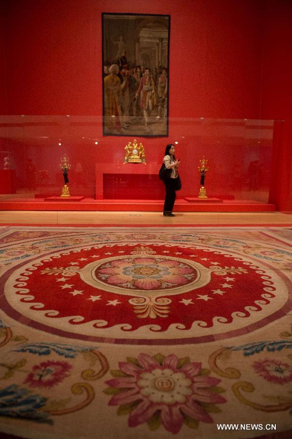 A woman stands in the exhibition hall for the upcoming exhibition of furniture and ornaments from the Fontainebleau Palace from 1804 to 1815 in south China's Macao, April 15, 2013. The exhibition will be held from April 18 to July 14 at Macao Museum of Art . (Xinhua/Cheong Kam Ka) 