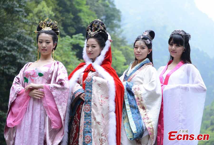 Actresses in costumes of the "Four Beauties" in ancient China pose for photos in Jinfo Shan (Golden Buddha Mountain) in Chongqing, April 16, 2013. A series of photos featuring the four ancient Chinese women, Xi Shi (7th to 6th century BC, Spring and Autumn Period), Wang Zhaojun (1st century BC, Western Han Dynasty), Diaochan (3rd century, Late Eastern Han/Three Kingdoms period) and Yang Yuhuan (719–756, Tang Dynasty), are to be photographed in the scenic spot. Wang Zhaojun is played by Wang Yuting, the 78th lineal descendant of the ancient beauty. (CNS/Cao Duoran)