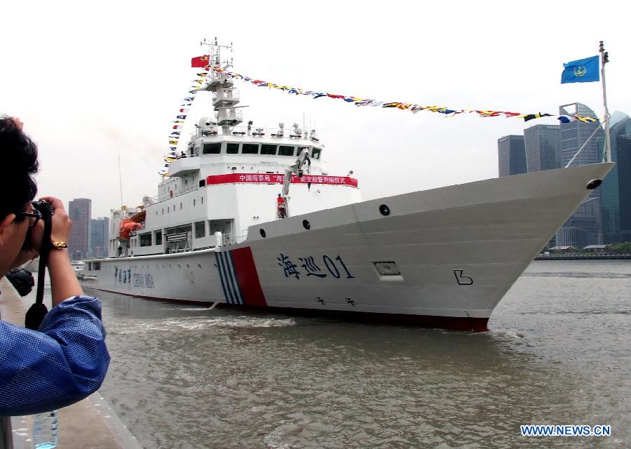 Patrol vessel Haixun 01 makes sail from a port in Shanghai, east China, April 16, 2013. Haixun 01, officially delivered and put into service Tuesday and managed by the Shanghai Maritime Bureau, is China's largest and most advanced patrol vessel. The 5,418-tonnage Haixun01 is 128.6 meters in length and has a maximum sailing distance of 10,000 nautical miles (18,520 km) without refueling. It will carry out missions regarding maritime inspection, safety monitoring, rescue and oil spill detection and handling. (Xinhua/Chen Fei) 