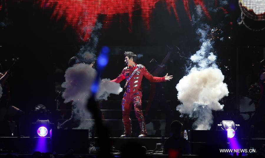 Chinese-American singer-songwriter Leehom Wang performs during Leehom Wang Music Man II-Open Fire at O2 Arena in London, Britain, April 15, 2013. (Xinhua/Wang Lili) 