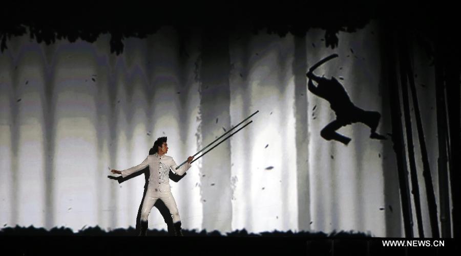 Chinese-American singer-songwriter Leehom Wang performs during Leehom Wang Music Man II-Open Fire at O2 Arena in London, Britain, April 15, 2013. (Xinhua/Wang Lili) 