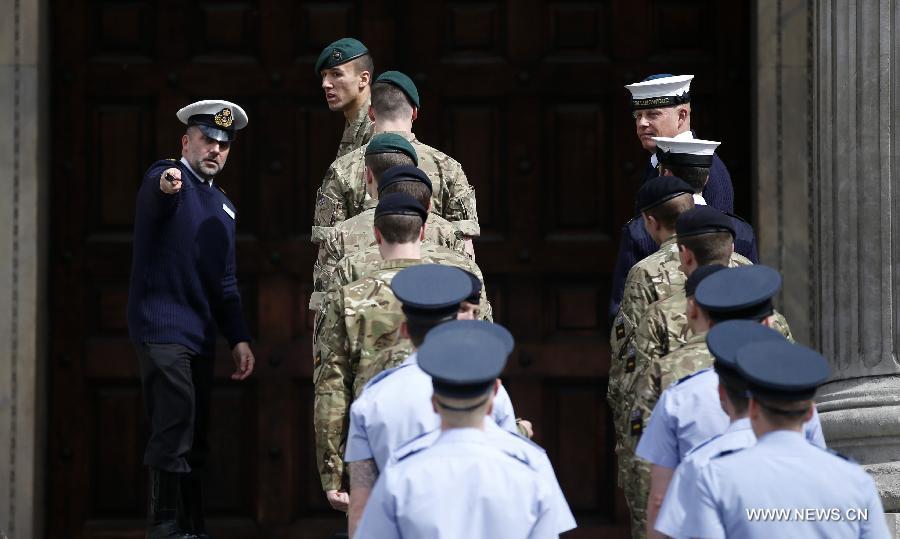 Service men rehearse outside St Paul's Cathedral ahead of the funeral of former Prime Minister Margaret Thatcher in London, April 16, 2013. A ceremonial funeral service for Lady Thatcher will be held at St Paul's Cathedral in London on Wednesday. (Xinhua/Wang Lili) 