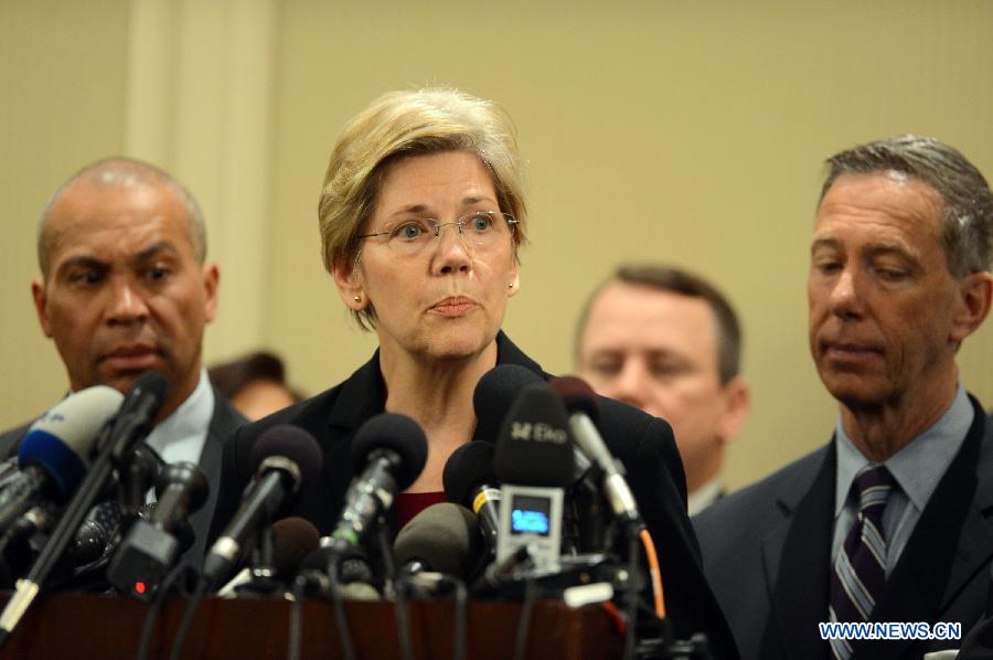 U.S. Senator (MA) Elizabeth Warren (C) speaks during a press conference in Boston, the United States, April 16, 2013. The death toll has risen to three, with 176 people injured, 17 of whom in critical conditions. (Xinhua/Wang Lei) 
