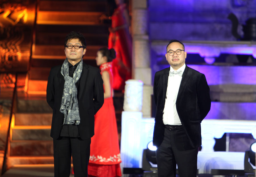 Festival jury members Korean director Je-gyu Kang (left), and Chinese director, Zhang Yibai (right) at the Opening Ceremony of the 3rd Beijing International Film Festival, at the Hall of Prayer for Good Harvests in the Temple of Heaven Park on Tuesday, April 16, 2013. [CRIENGLISH.com, Photo: Zhang Linruo]