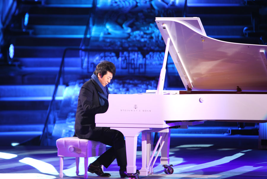 A Chinese pianist Lang Lang performs solo "I Love You, China" on stage at the Opening Ceremony of the 3rd Beijing International Film Festival, at the Hall of Prayer for Good Harvests in the Temple of Heaven Park on Tuesday, April 16, 2013. [CRIENGLISH.com, Photo: Zhang Linruo]