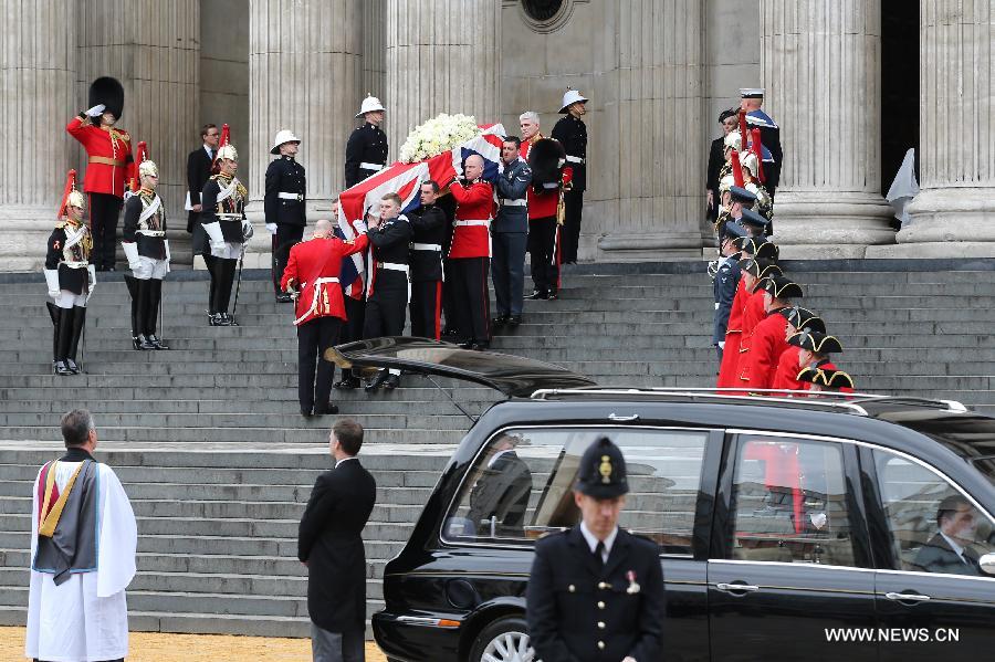 The coffin of British former prime minister Margaret Thatcher is carried out of St. Paul's Cathedral following the ceremonial funeral service in London, Britain, April 17, 2013. The funeral of Margaret Thatcher, the first female British prime minister, started 11 a.m. local time on Wednesday in London. (Xinhua/Yin Gang)