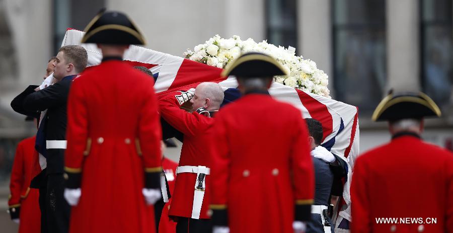 The coffin of British former prime minister Margaret Thatcher is carried into St. Paul's Cathedral in London, Britain, April 17, 2013. The funeral of Margaret Thatcher, the first female British prime minister, started 11 a.m. local time on Wednesday in London. (Xinhua/Wang Lili) 