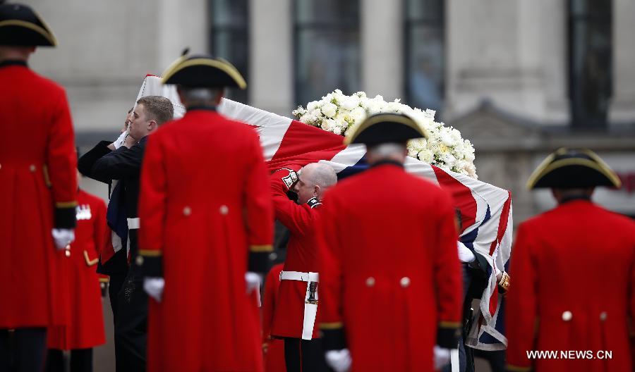 The coffin of British former prime minister Margaret Thatcher is carried into St. Paul's Cathedral in London, Britain, April 17, 2013. The funeral of Margaret Thatcher, the first female British prime minister, started 11 a.m. local time on Wednesday in London. (Xinhua/Wang Lili)