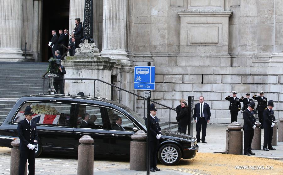 The coffin of British former prime minister Margaret Thatcher is placed into a hearse outside St. Paul's Cathedral following the ceremonial funeral service in London, Britain, April 17, 2013. The funeral of Margaret Thatcher, the first female British prime minister, started 11 a.m. local time on Wednesday in London. (Xinhua/Yin Gang)