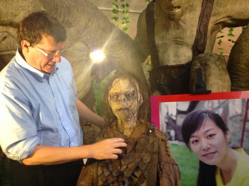 Weta Workshop founder, five-time Academy Award winner Sir Richard Taylor personally demonstrates special effects make-up on the full-scale model of an orc from the movie "The Hobbit: An Unexpected Journey" at the "The Best in Wo-Film Carnival," in Beijing on April 16, 2013. "The Best in Wo-Film Carnival," which is open to the public from April 16-23 during the 3rd Beijing International Film Festival, is a large-scale public cultural activity integrating film cultural entertainment and interactive experiences, as well as tourism and leisure. (China.org.cn)