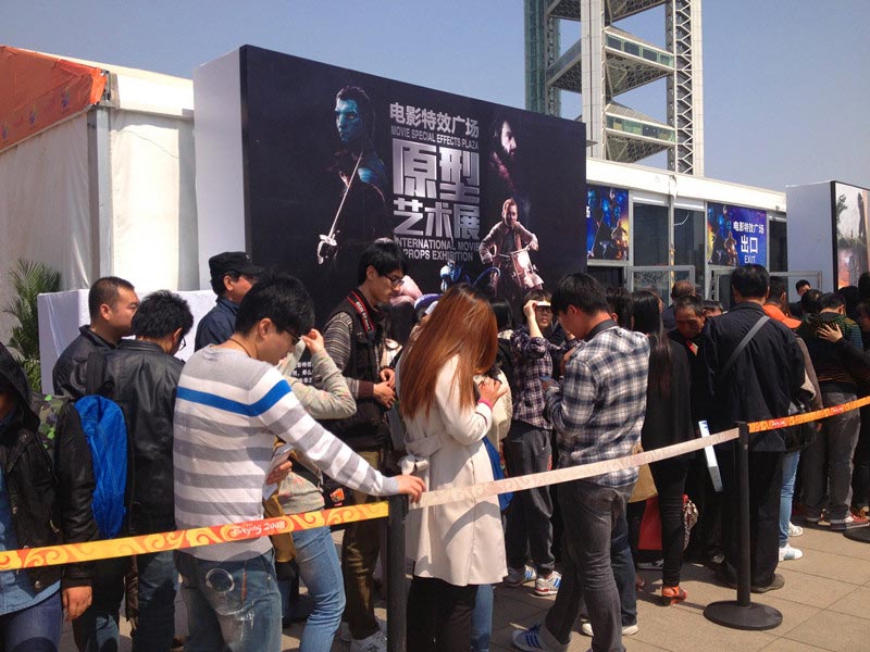 Film fans get in line on the opening day of the Special Effects Exhibit of "The Best in Wo-Film Carnival," in Beijing, April 16, 2013. The carnival is open to the public from April 16-23 during the 3rd Beijing International Film Festival and is a large-scale public cultural activity integrating film cultural entertainment and interactive experiences, as well as tourism and leisure. (China.org.cn)