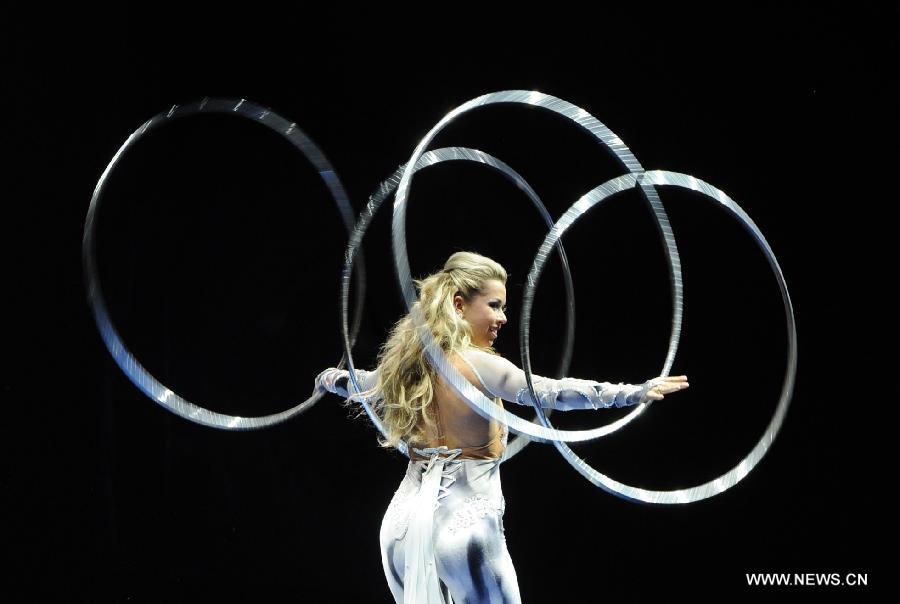An artist performs during the opening ceremony of the 5th Men's and Women's Artistic Gymnastics Individual European Championships in Moscow, Russia, April 17, 2013. The event kicked off here on Wednesday. (Xinhua/Jiang Kehong)