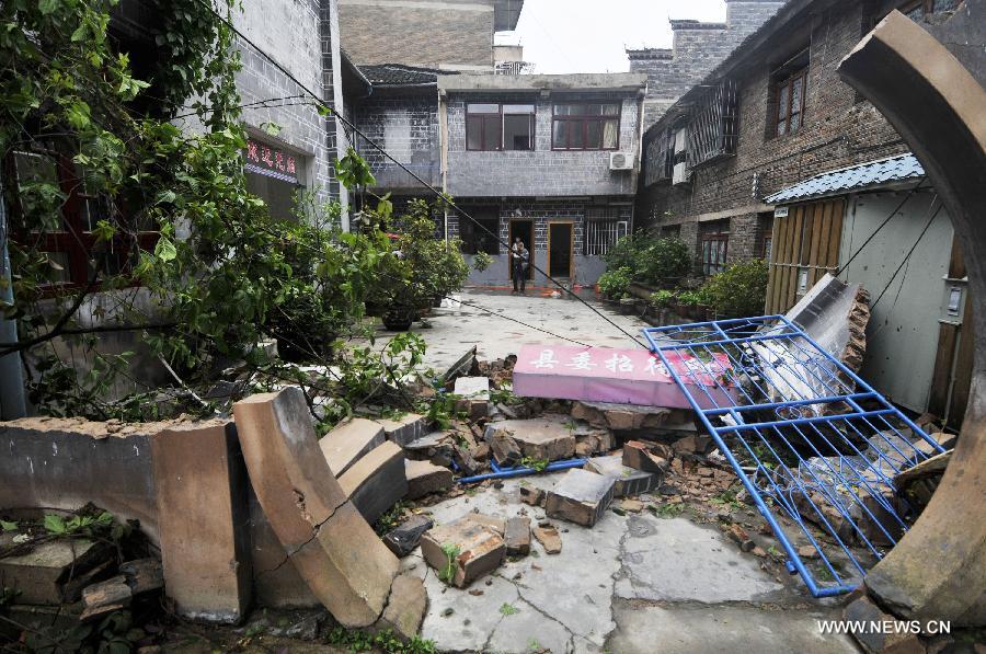 Photo taken on April 18, 2013 shows the buildings in a mess after tornado and hailstorm hit Zhenyuan County, southwest China's Guizhou Province. The county was hit by tornado and hailstorm on Wednesday night with houses wrecked and vehicles smashed by fallen trees. (Xinhua)