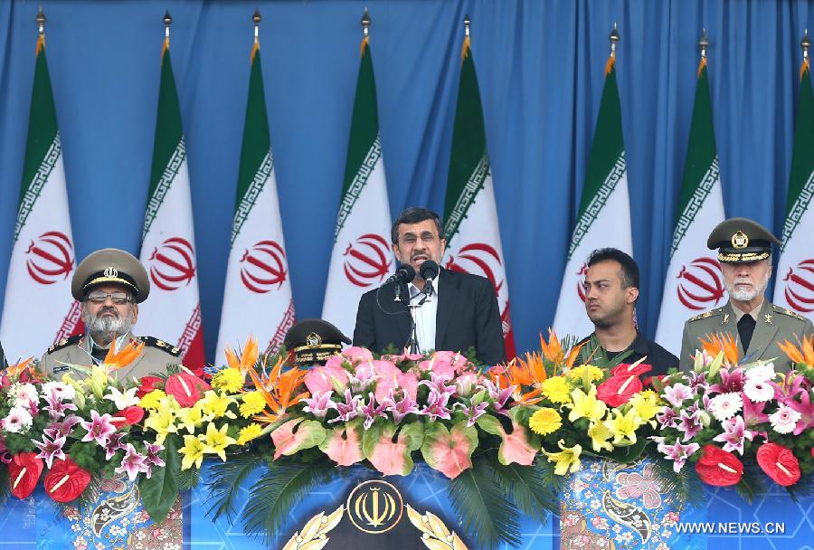 Iranian President Mahmoud Ahmadinejad (C) speaks during the Army Day parade in Tehran, Iran, April 18, 2013. Ahmadinejad said that the Iranians will maintain security of the Persian Gulf through a collective work of regional states. (Xinhua/Abolfazl Nesaei) 