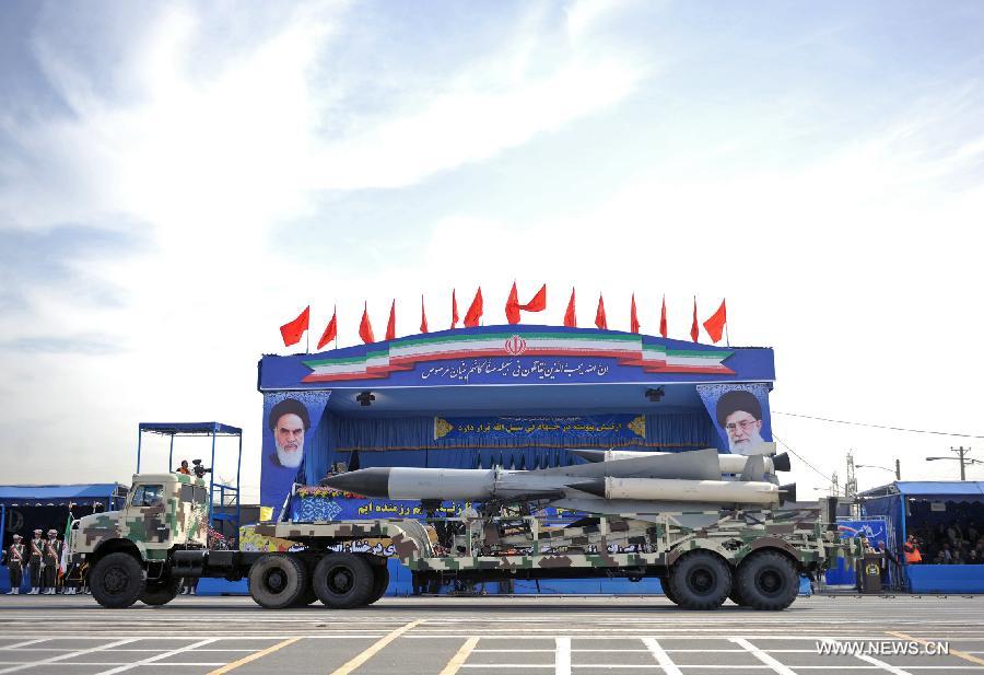 A military vehicle carries a missile during the Army Day parade in Tehran, Iran, April 18, 2013. Iranian President Mahmoud Ahmadinejad said that the Iranians will maintain security of the Persian Gulf through a collective work of regional states. (Xinhua/Abolfazl Nesaei) 