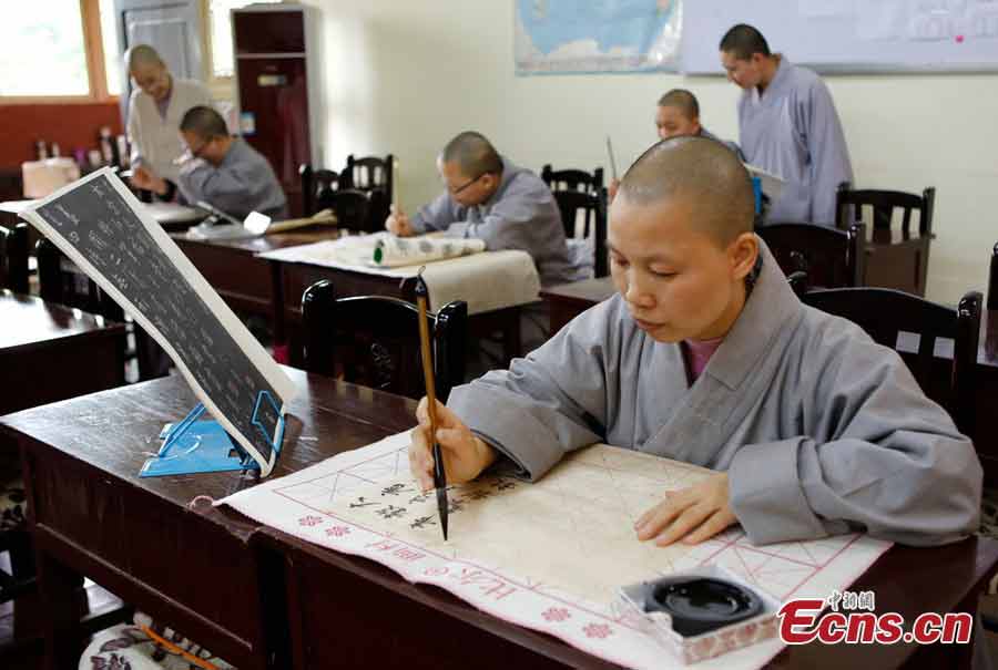 A student practices calligraphy at the Buddhist Academy of Emei Mountain in Emei Mountain, Southwest China's Sichuan Province. Established in 1927, the school, covering an area of more than 10,000 square meters presently, has courses mainly on Buddhism studying. (CNS/Liu Zhongjun)