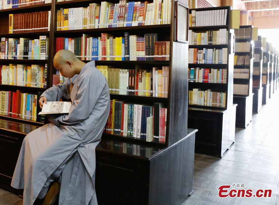 A student reads a book at the library of the Buddhist Academy of Emei Mountain in Emei Mountain, Southwest China's Sichuan Province. Established in 1927, the school, covering an area of more than 10,000 square meters presently, has courses mainly on Buddhism studying. (CNS/Liu Zhongjun)