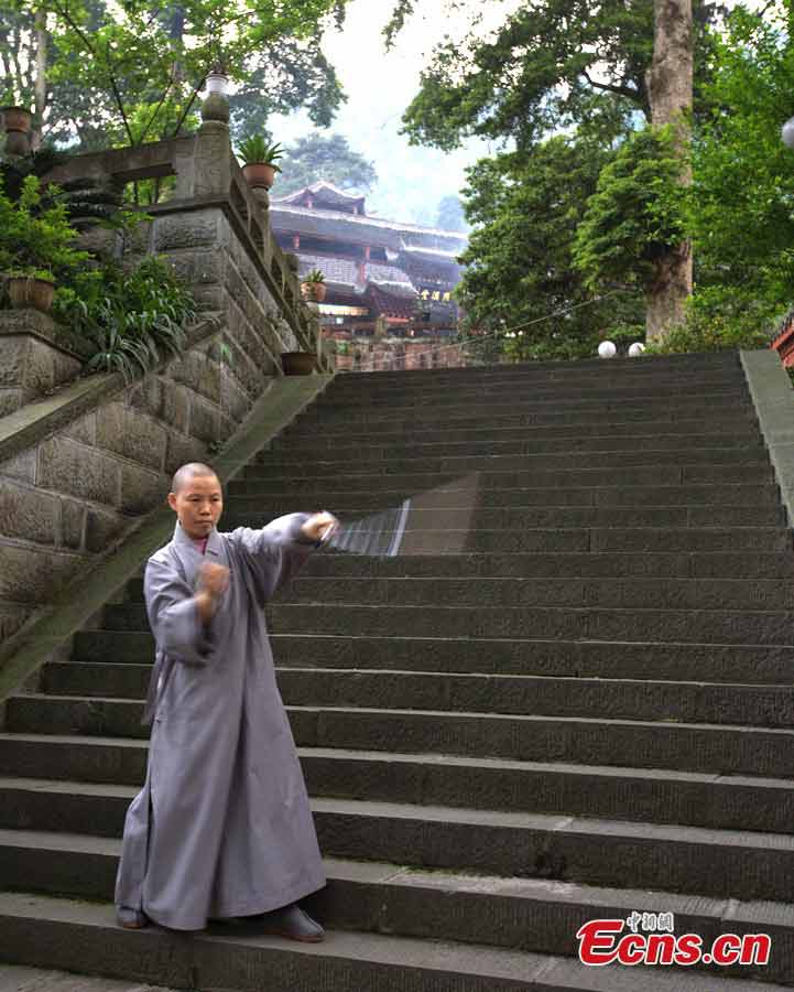 A student practices kung fu at the Buddhist Academy of Emei Mountain in Emei Mountain, Southwest China's Sichuan Province. Established in 1927, the school, covering an area of more than 10,000 square meters presently, has courses mainly on Buddhism studying. (CNS/Liu Zhongjun)