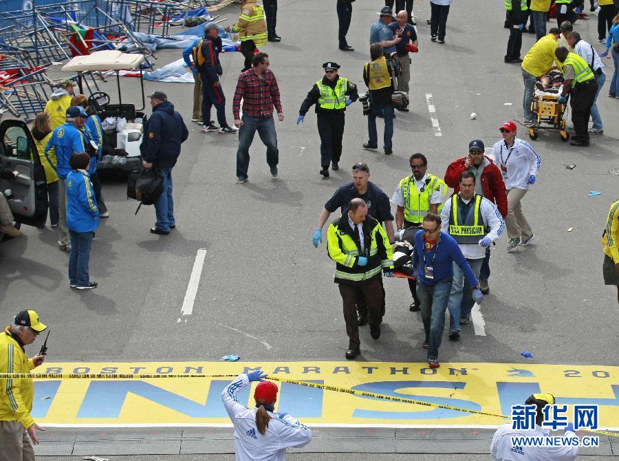 Policemen work at the blast site in Boston, the United States, April 17, 2013. U.S. investigators believed that they have identified a suspect for Monday's Boston Marathon bombings, which killed three people and injured over 170 others, U.S. media reported on Wednesday. (Xinhua/Wang Lei) 