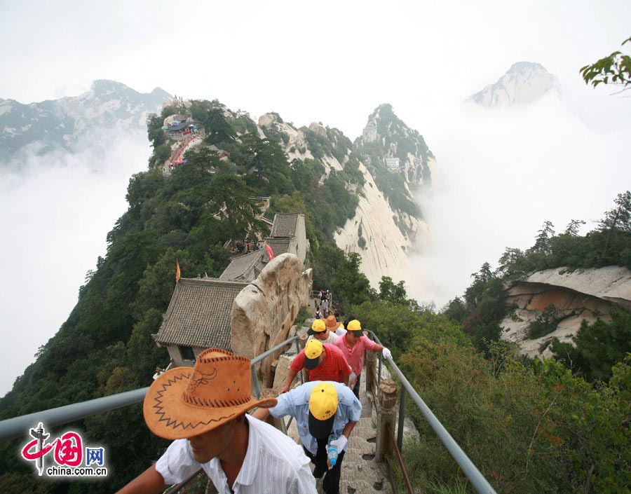 Located in Huayin City, about 120 kilometres east of the city of Xi'an, Mount Hua, one of China's Five Great Mountains, is holy ground for Taoism. It features over 20 Taoist temples, of which the Jade Spring and Zhenyue Palaces are the most famous. It has five peaks, east, west, south, north and central, of which the highest is the South Peak at 2154.9m. Aside from these elements, it is also one of the nine best places to see the sun rise in China. Chaoyang Peak is the best place to watch the sunrise. (China.org.cn)