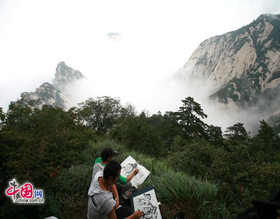 Located in Huayin City, about 120 kilometres east of the city of Xi'an, Mount Hua, one of China's Five Great Mountains, is holy ground for Taoism. It features over 20 Taoist temples, of which the Jade Spring and Zhenyue Palaces are the most famous. It has five peaks, east, west, south, north and central, of which the highest is the South Peak at 2154.9m. Aside from these elements, it is also one of the nine best places to see the sun rise in China. Chaoyang Peak is the best place to watch the sunrise. (China.org.cn)