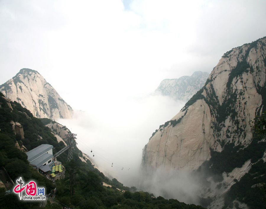 Located in Huayin City, about 120 kilometres east of the city of Xi'an, Mount Hua, one of China's Five Great Mountains, is holy ground for Taoism. It features over 20 Taoist temples, of which the Jade Spring and Zhenyue Palaces are the most famous. It has five peaks, east, west, south, north and central, of which the highest is the South Peak at 2154.9m. Aside from these elements, it is also one of the nine best places to see the sun rise in China. Chaoyang Peak is the best place to watch the sunrise. (China.org.cn)