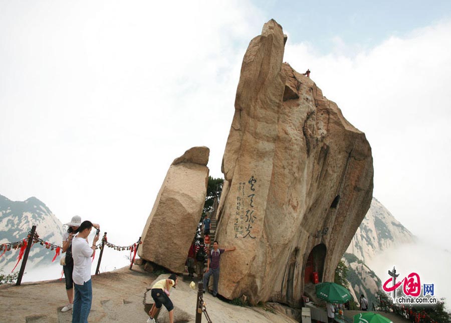 Located in Huayin City, about 120 kilometres east of the city of Xi'an, Mount Hua, one of China's Five Great Mountains, is holy ground for Taoism. It features over 20 Taoist temples, of which the Jade Spring and Zhenyue Palaces are the most famous. It has five peaks, east, west, south, north and central, of which the highest is the South Peak at 2154.9m. Aside from these elements, it is also one of the nine best places to see the sun rise in China. Chaoyang Peak is the best place to watch the sunrise. (China.org.cn)