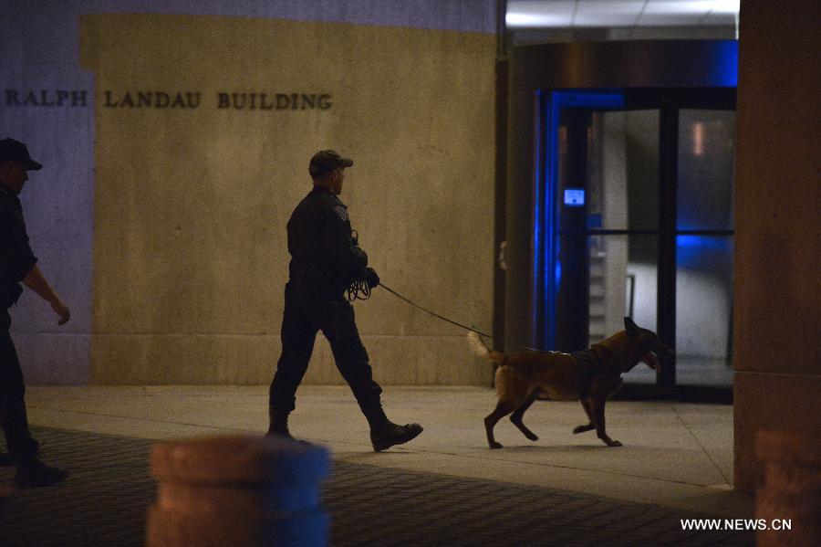 Policemen patrol on the Massachusetts Institute of Technology (MIT) campus in Boston, the United States, April 19, 2013. The police officer who was shot on the MIT campus in Boston Thursday night has died, CNN reported on Thursday. (Xinhua/Zhang Jun)