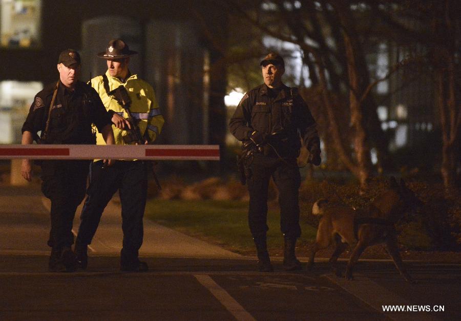Policemen patrol at the scene where a police officer was shot on the Massachusetts Institute of Technology (MIT) campus in Boston, the United States, April 18, 2013. The police officer who was shot on the MIT campus in Boston has died, CNN reported on Thursday. (Xinhua/Zhang Jun) 